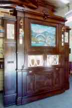 Early Weber Otero Orchestrion with an elaborate animated scene at top front center.
